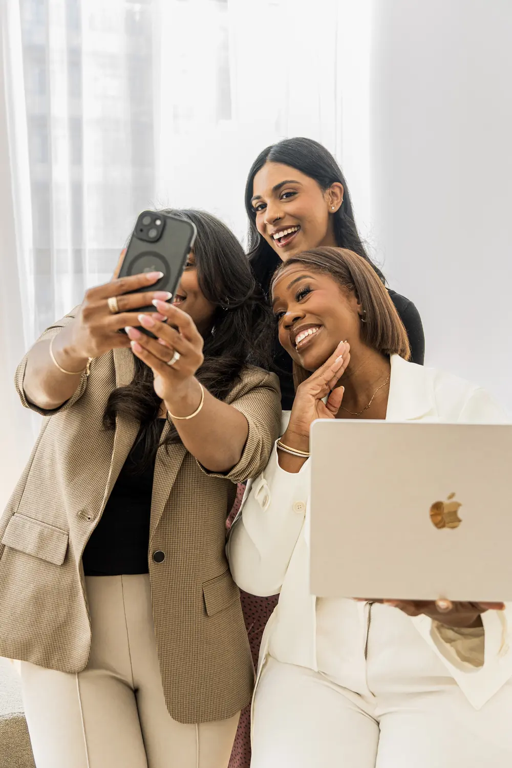 Three team members taking a selfie together